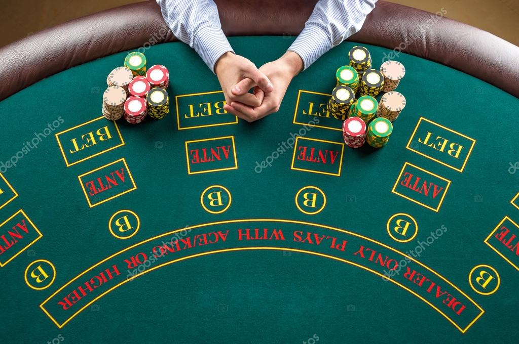 https://st2.depositphotos.com/5954192/9678/i/950/depositphotos_96781338-stock-photo-closeup-of-poker-player-with.jpg